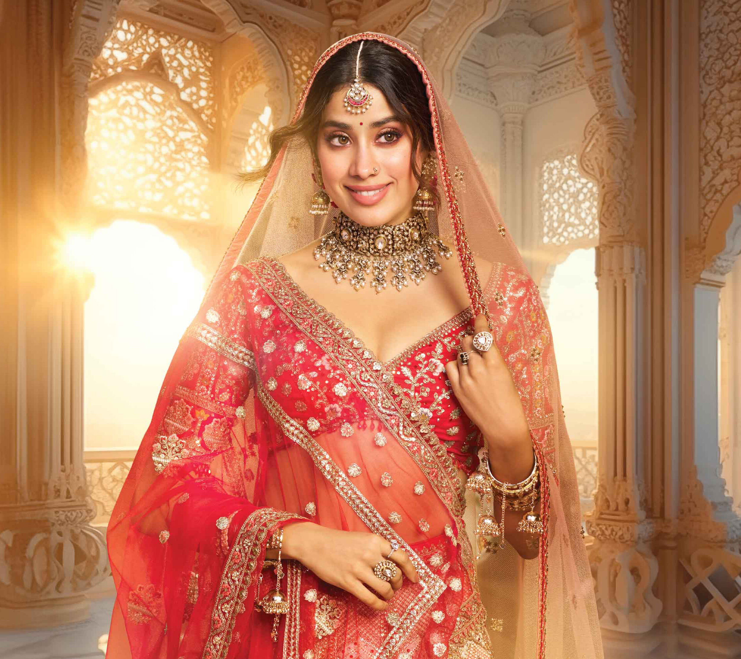 Indian bride in traditional saree with the red maang tikka